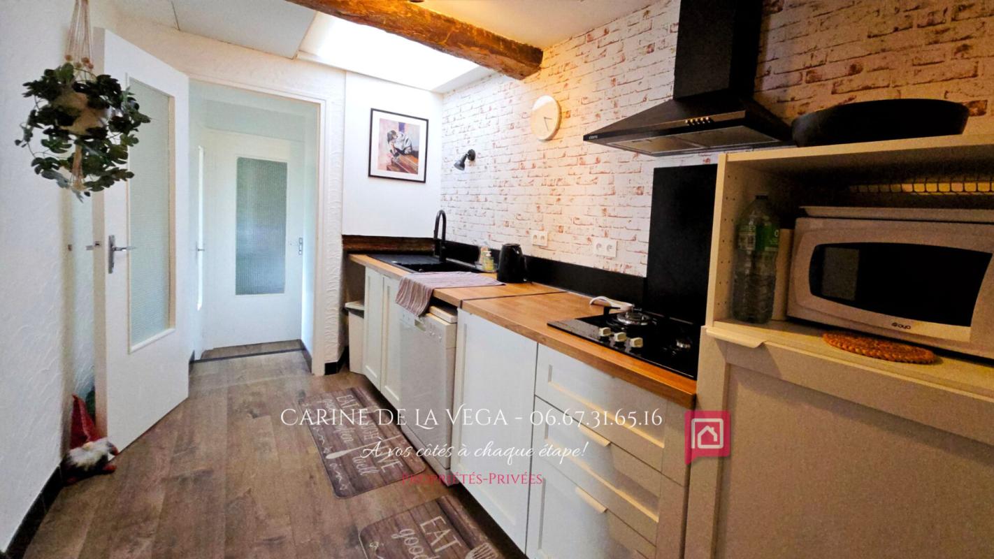 FAUGERES Maison en pierre 87 m2 avec garage, terrasse, jardin 3