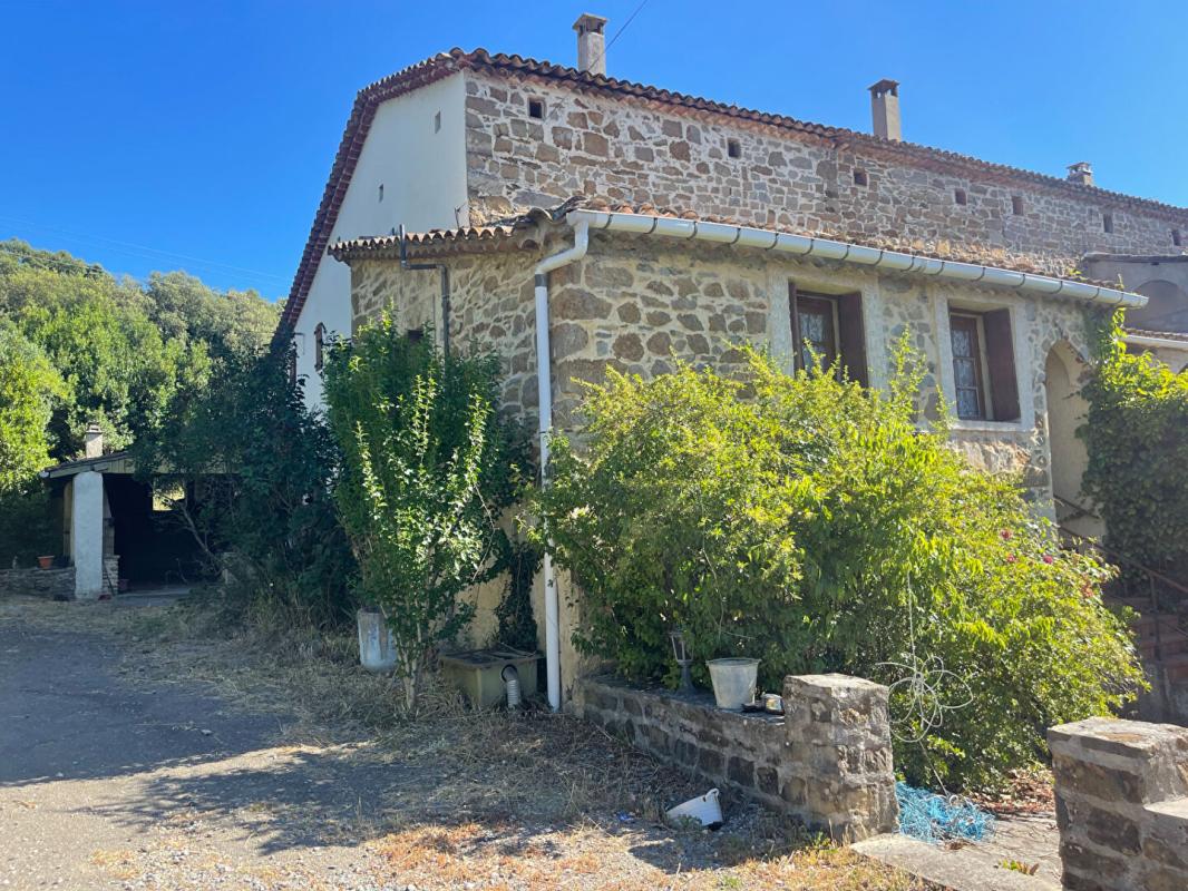 ANDUZE Mas en pierres mitoyen proche Anduze sur terrain constructible de 1900 m2 1
