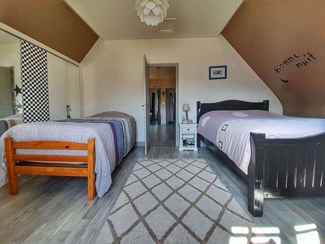 BUZY Charmante demeure en pierre avec vaste sous-sol et jardin paysager 7