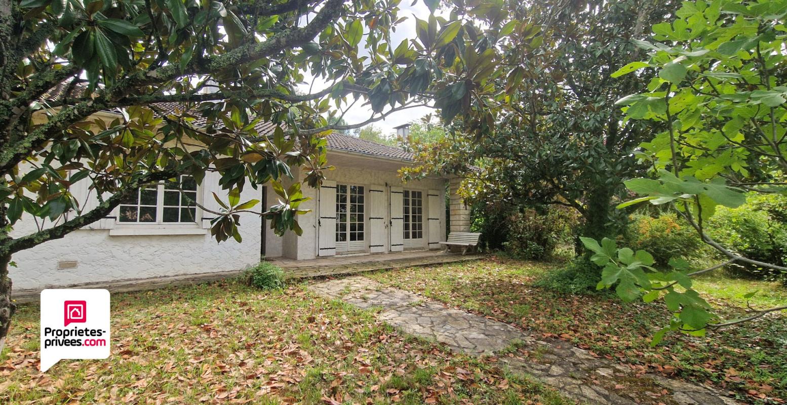 LANGON Maison de plain-pied de 120m² - 3 chambres - Garage - Dépendances - Terrain arboré de 2070m² 2