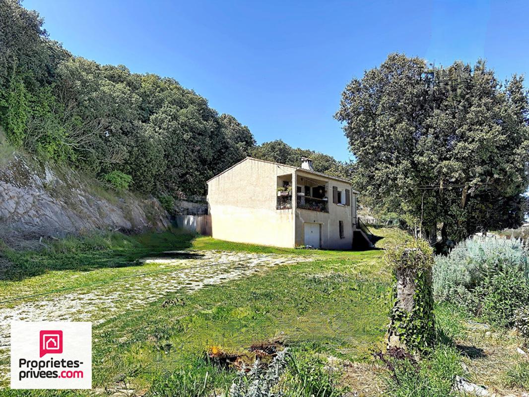 GINASSERVIS Villa avec grand garage sur 2360 m² de terrain divisible 2