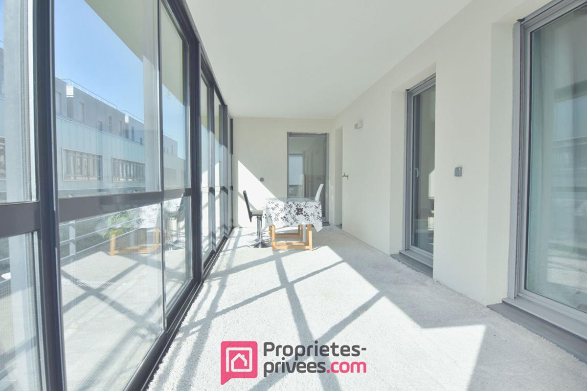 BOULOGNE-BILLANCOURT Appartement  3 pièces 66,03 m² Carrez  avec 18 m² de jardin d'hiver et 8 m² de balcon filant 12
