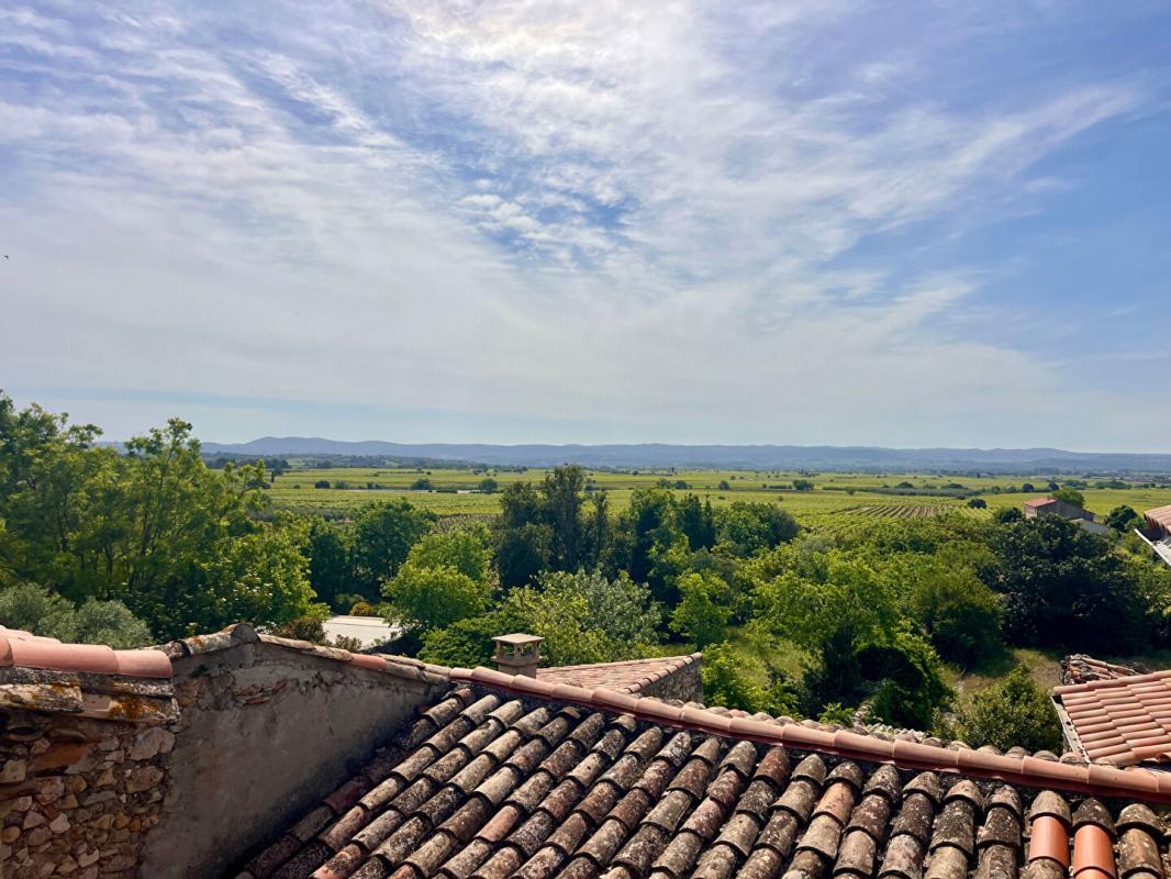SAINT-SATURNIN-DE-LUCIAN Maison de village traversante avec terrasse et atelier 1